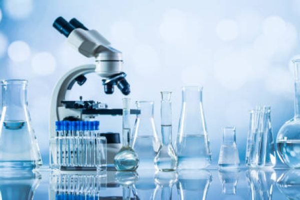 Science laboratory research and development concept. microscope with test tubes